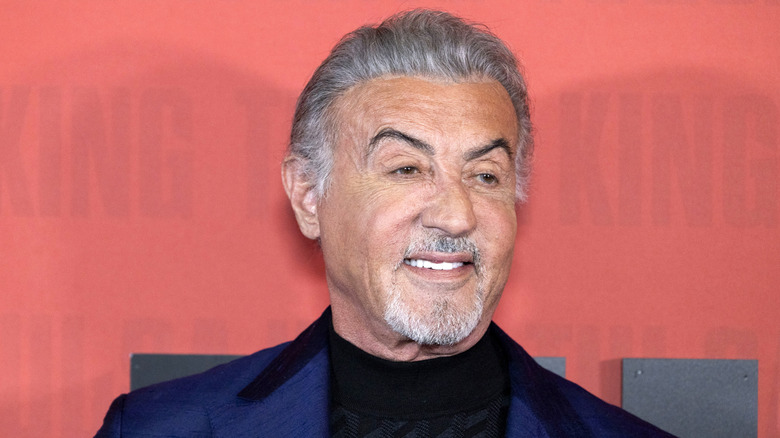 Sylvester Stallone smiling at the Tulsa King Season 3 premiere in 2025.