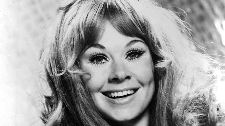 Sue Ane Langdon smiling in a black and white photo.