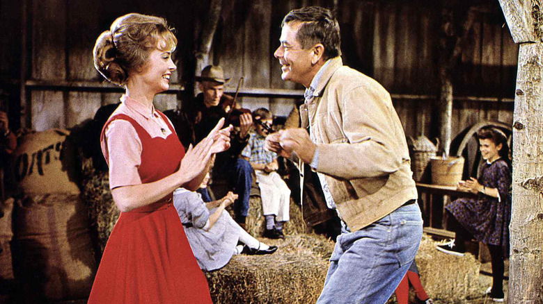 Sue Ane Langdon and Glenn Ford dancing together in "The Rounders."