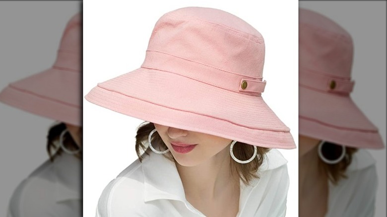 woman wearing pink bucket hat