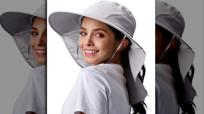 woman wearing Camptrace gray long sun hat
