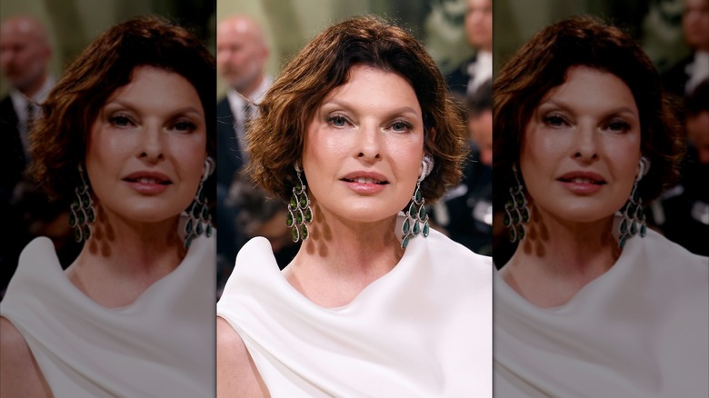 Close-up of Linda Evangelista smiling with a mid-length bob.