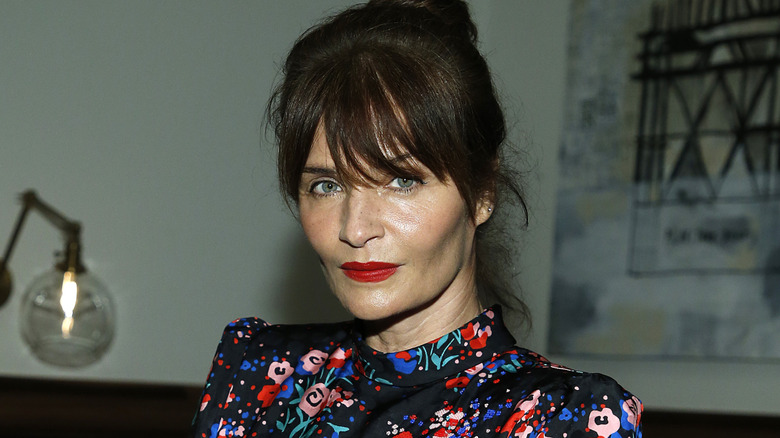 Helena Christensen wearing red lipstick