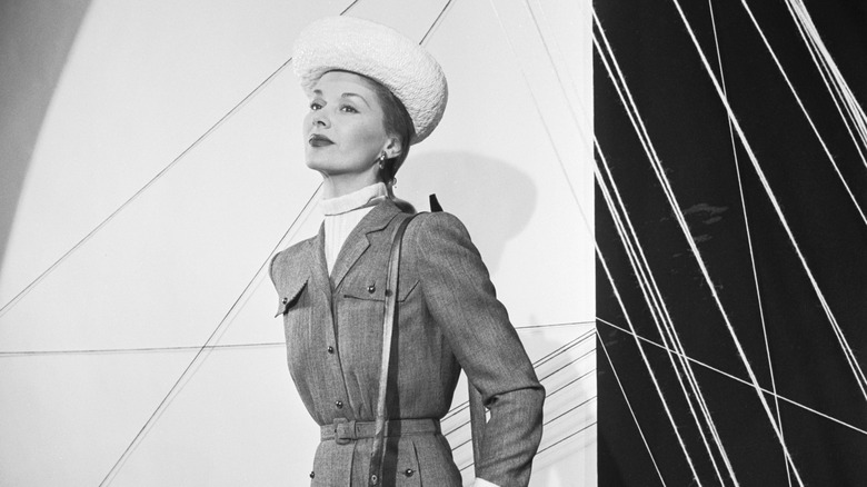 Lisa Fonssagrives in a vintage shoot wearing a hat and blazer