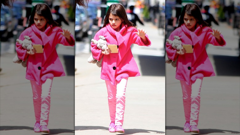 Suri Cruise walking in New York City in 2013