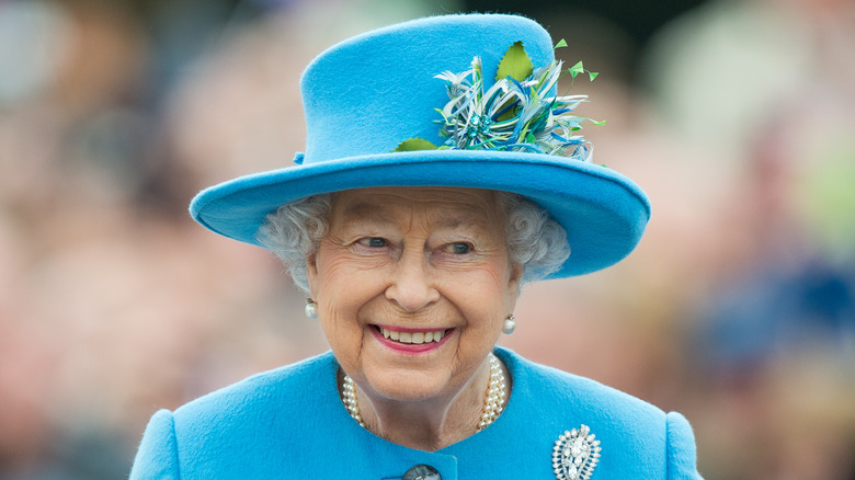 Queen Elizabeth II in blue hat