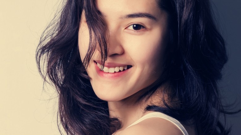 smiling woman hair in face