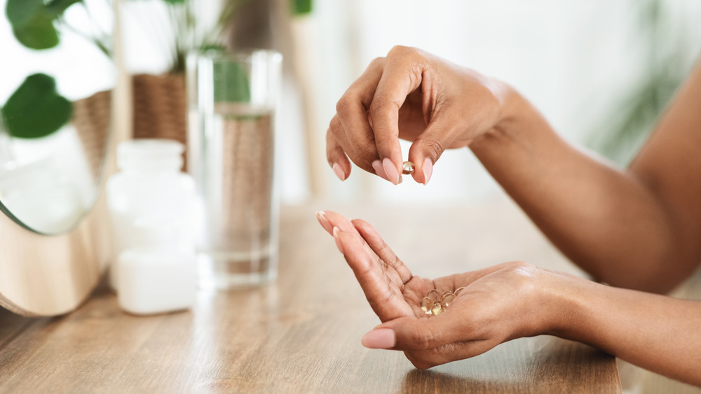 Woman taking supplements