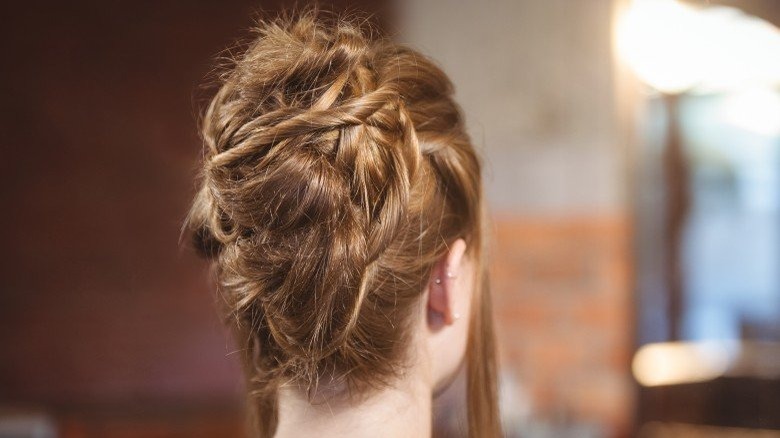 A woman with a styled updo