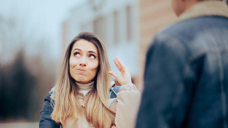 A woman ignoring man