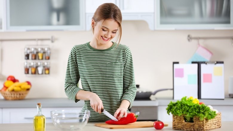 A woman cooking in a kitchen