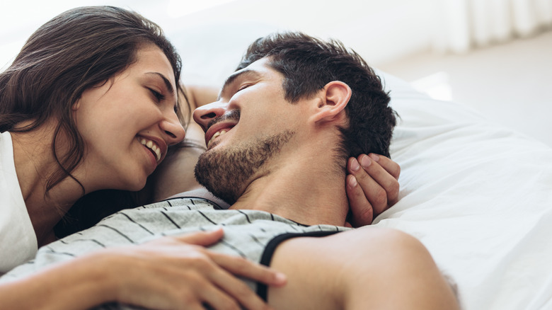 couple cuddling in bed