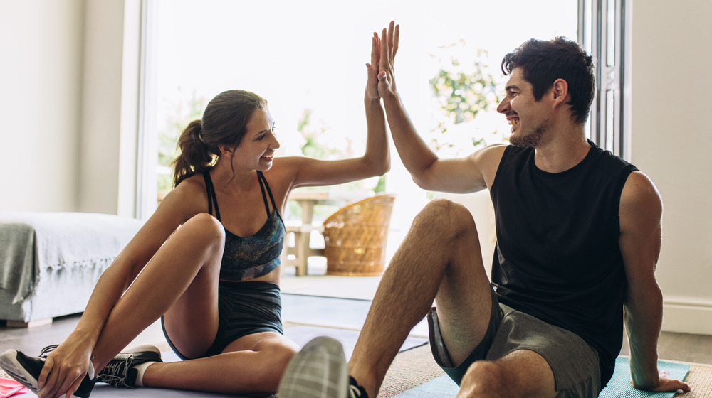 two people working out at home together