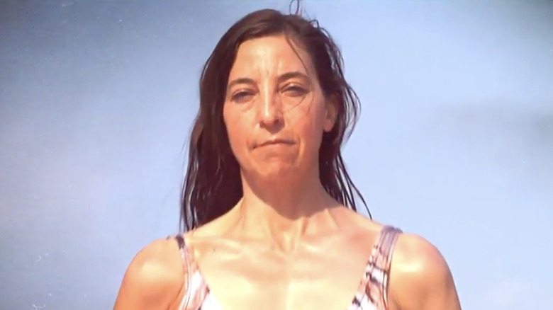 Debbie Wanner posing on a beach while competing in Survivor