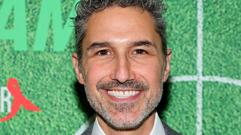 Ethan Zohn posing on red carpet