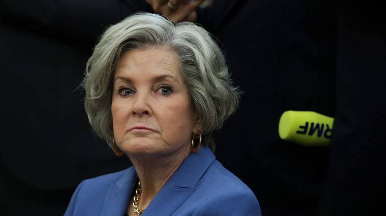 Susie Wiles looking grumpy in a blue blazer