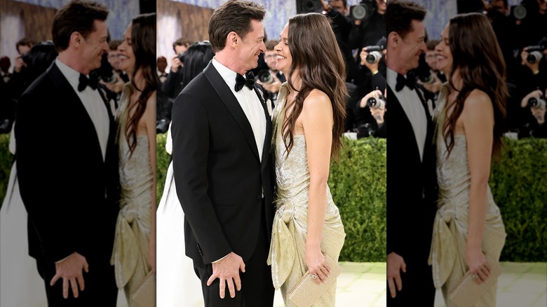 Hugh Jackman and Sutton Foster facing each other and laughing at the Met Gala.