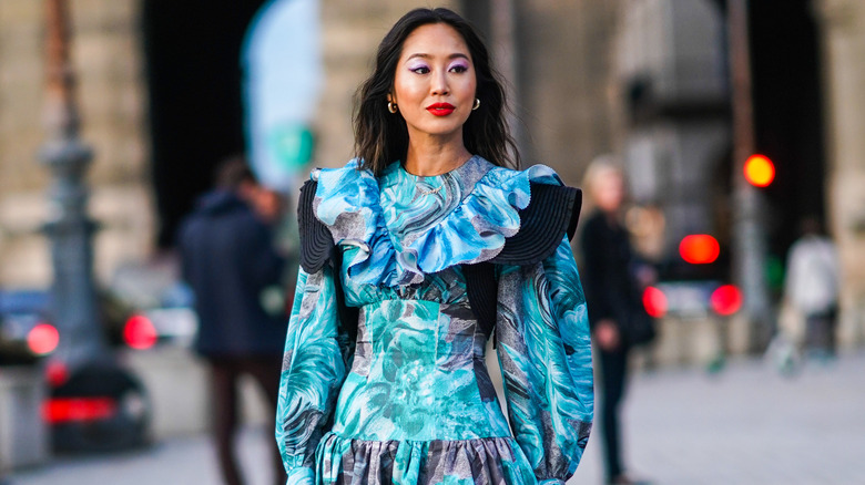 woman in blue dress posing