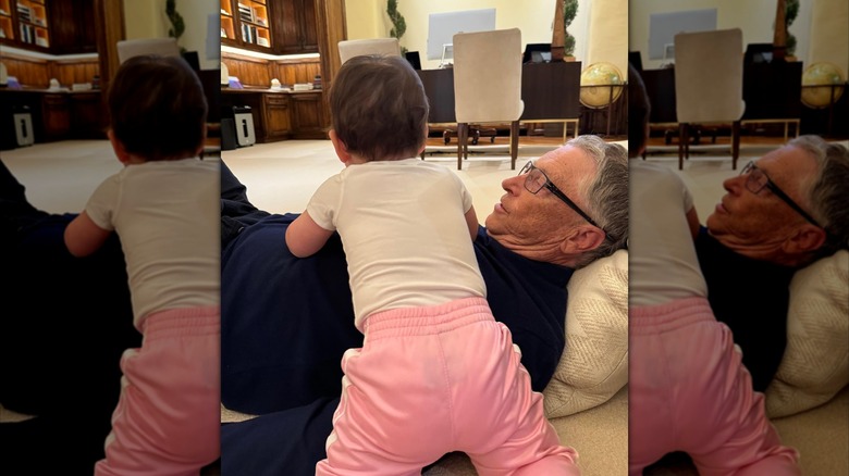 Leila crawls on grandpa Bill Gates' chest