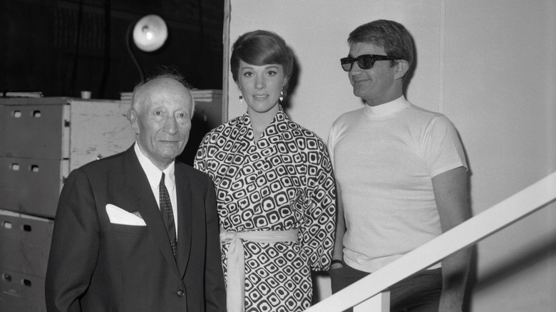 Julie Andrews, Blake Edwards, and an unnamed man on the set of the movie Darling Lili
