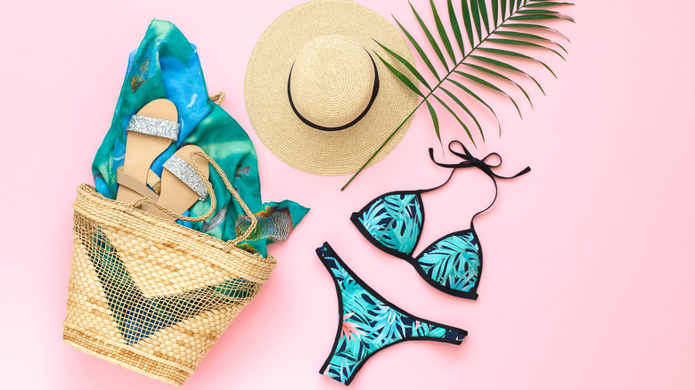 Image of swimsuit, hat, and beach bag