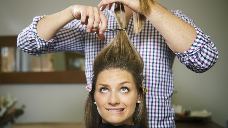 Woman looking worried about her haircut
