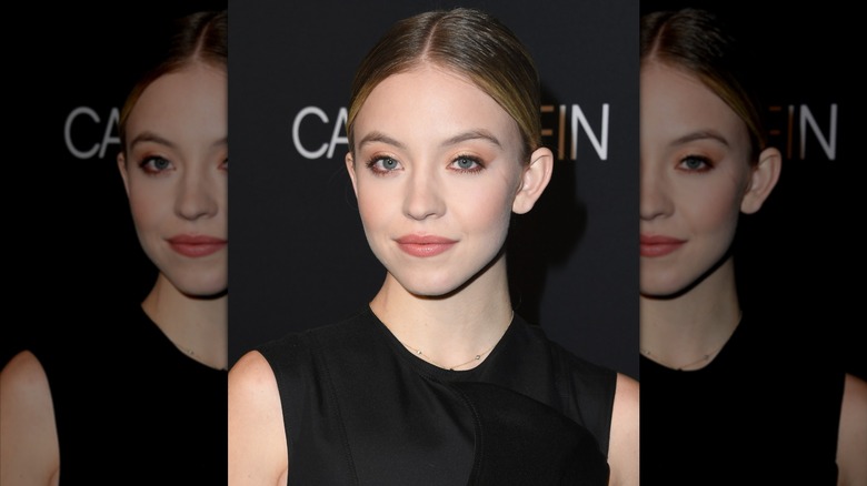 Sydney Sweeney hair back black dress