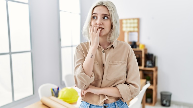 woman looking nervous in an office