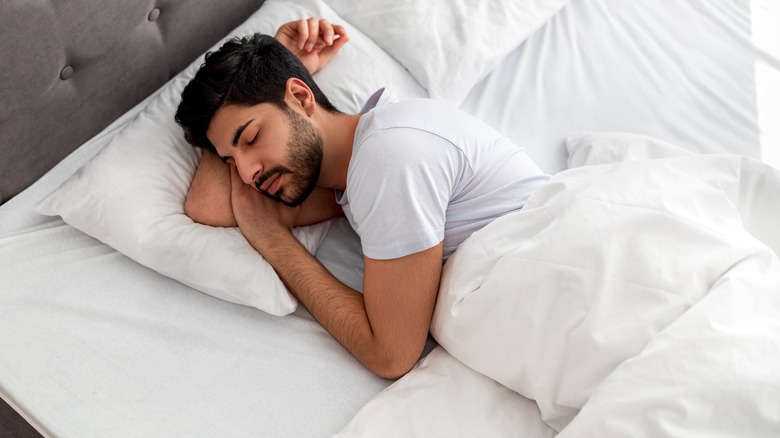man sleeping  in bed