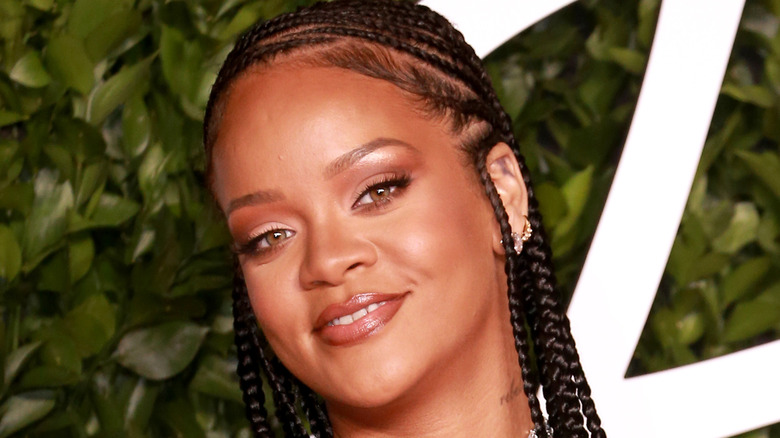 Rihanna smiling on red carpet