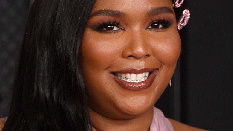 Lizzo smiling on red carpet