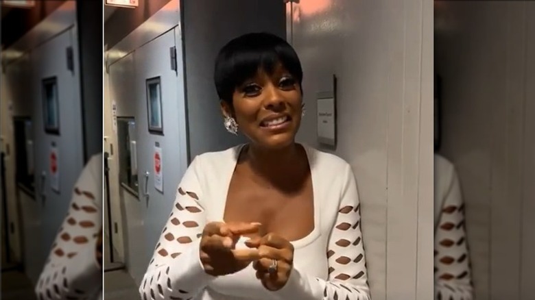 Tamron Hall backstage in white dress