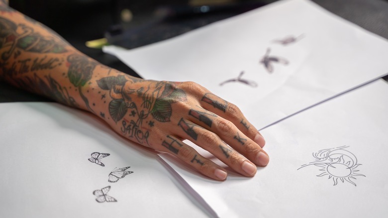 Tattooed hand and designs