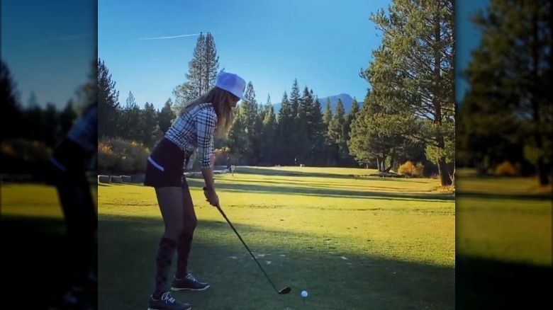 Taylor Cole playing golf