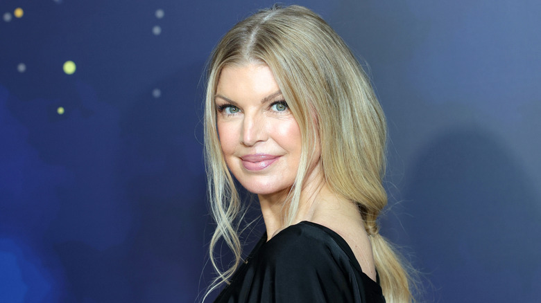 Fergie closeup against blue background