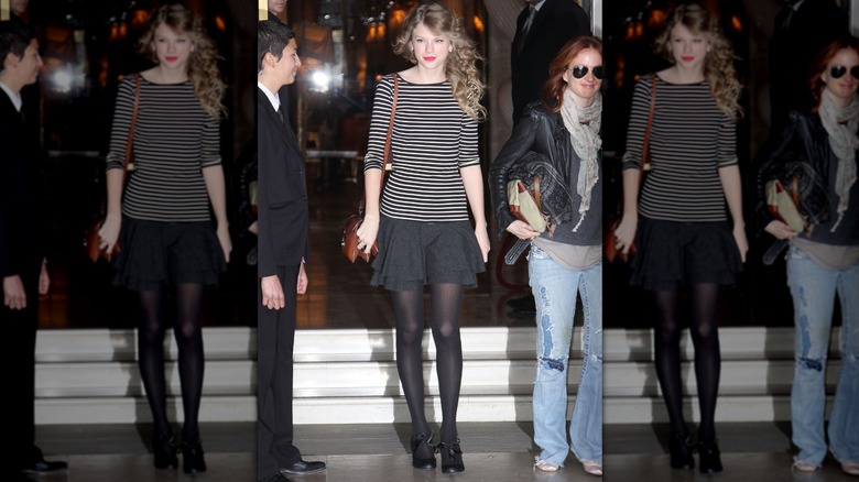 Taylor Swift wearing a striped top and black layered skirt.