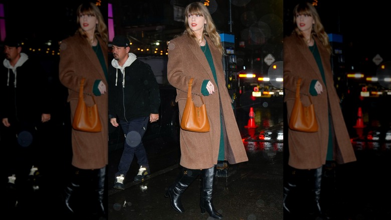 Taylor Swift wearing a brown coat and green sweater dress.
