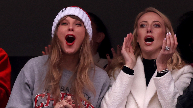 Taylor Swift and Brittany Mahomes cheering at the Kansas City Chiefs vs. New England Patriots game