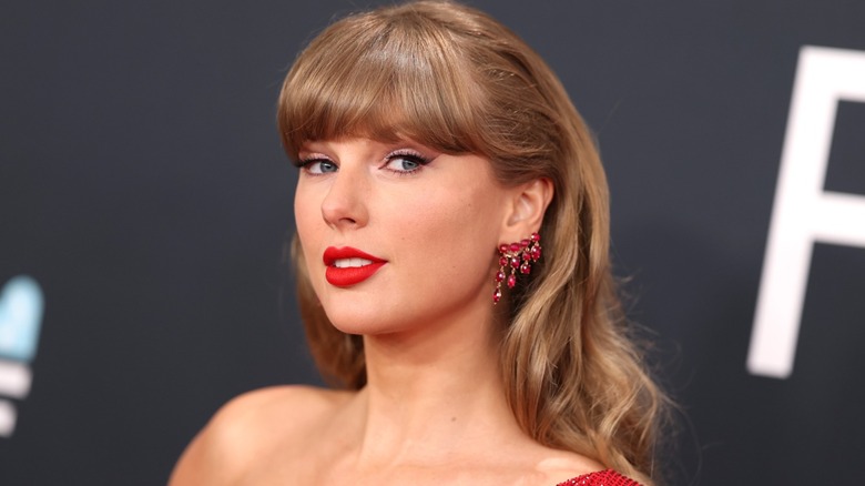 Closeup of Taylor Swift smiling on step-and-repeat