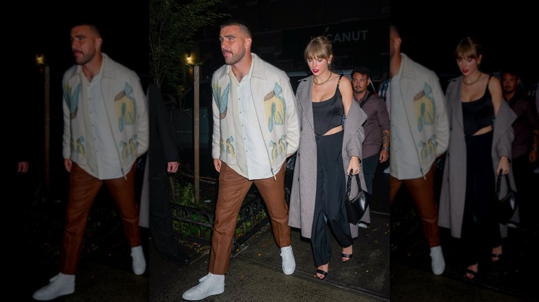 Travis Kelce holds hands with Taylor Swift