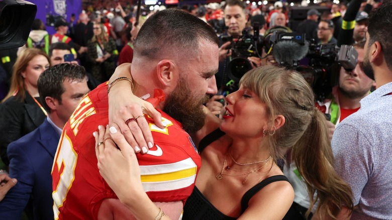 Travis Kelce hugging Taylor Swift