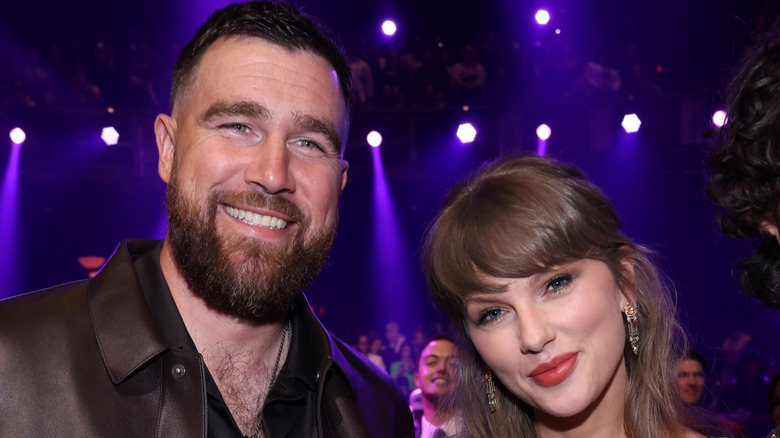 Travis Kelce and Taylor Swift smiling together