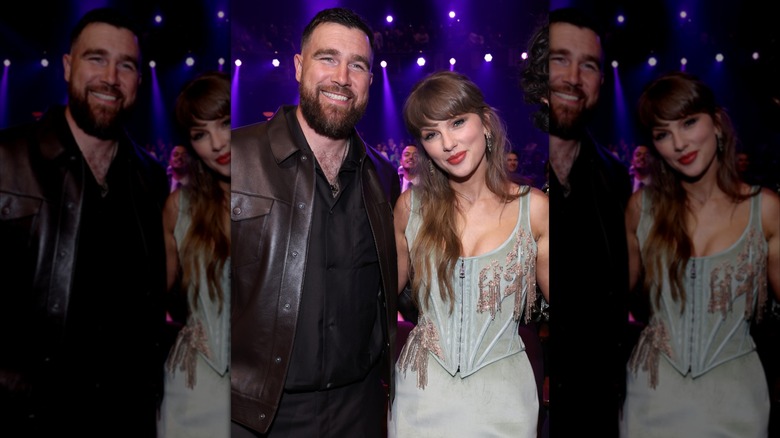 Travis Kelce posing with Taylor Swift at the iHeartRadio Music Awards