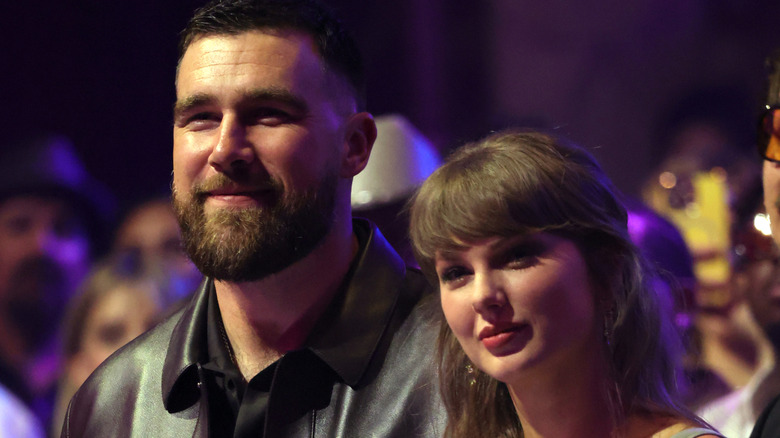Travis Kelce and Taylor Swift smiling