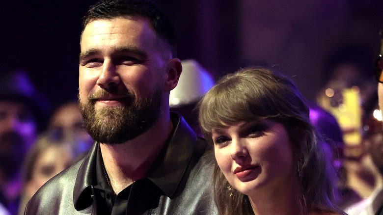Taylor Swift and Travis Kelce in low light March 2026 awards