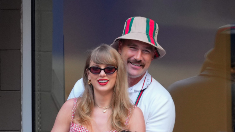 Travis Kelce hugs Taylor Swift