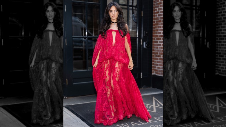 Camila Cabello stepping out of a New York hotel in a red dress