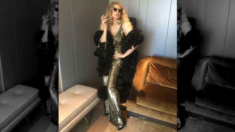 Fergie in a sparking gold dress and sunglasses