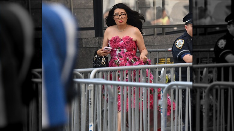 Jenny Han arriving outside Madison Square Garden in a pink floral dress