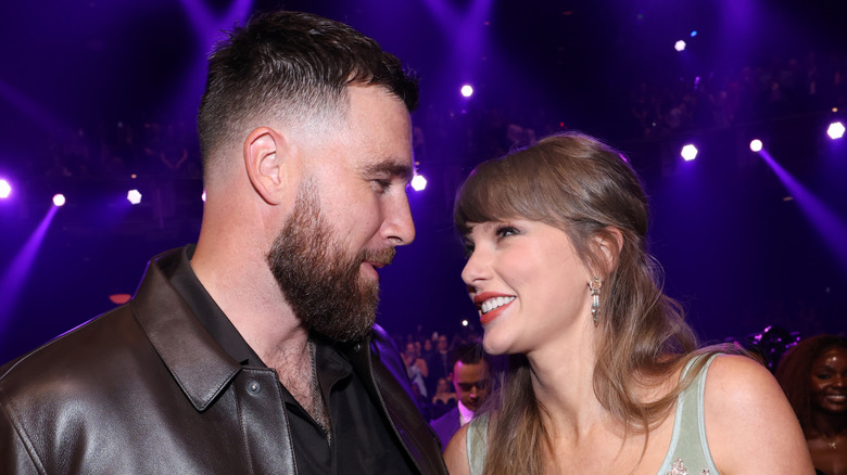 Taylor Swift and Travis Kelce looking lovingly at each other